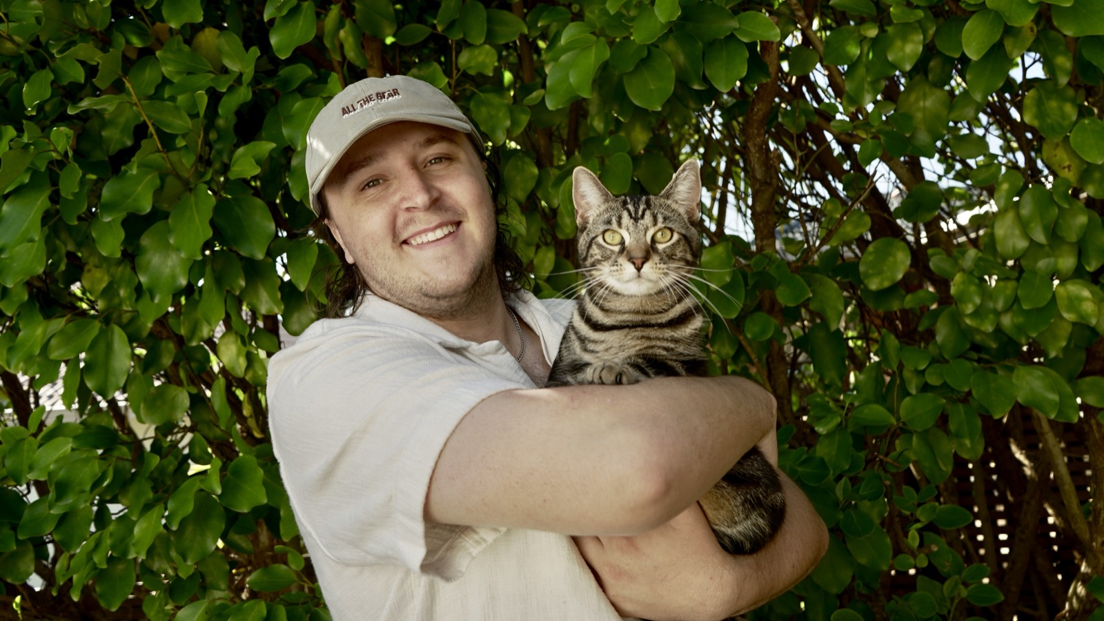 Ethan Fagan with Obi, the cat Obi Studios is named after
